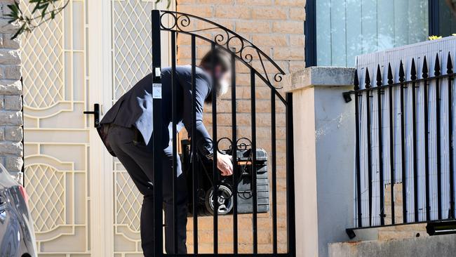 Federal officers enter the home of NSW Labor MP Shaoquett Moselmane in Rockdale, Sydney on Friday morning. Picture: Bianca De Marchi/AAP