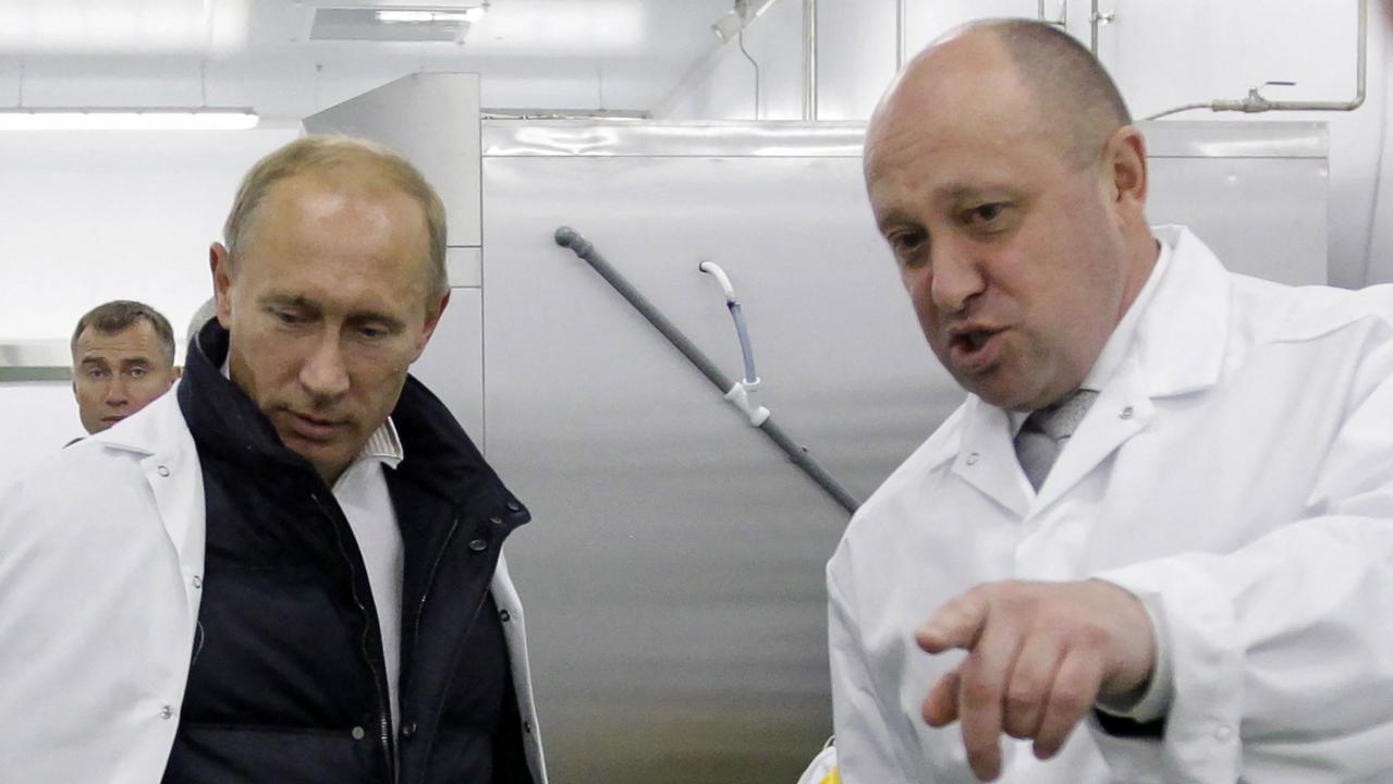 Putin and Progozhin together in 2010. (Photo by Alexey DRUZHININ / SPUTNIK / AFP)