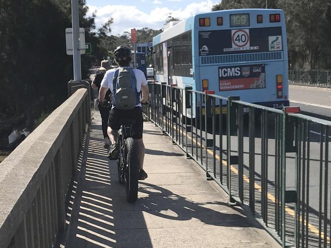 The narrow footpath on the Pittwater Rd bridge over Narrabeen Lagoon has been a conflict zone between walkers and cyclists for decades. Picture: Manly Daily