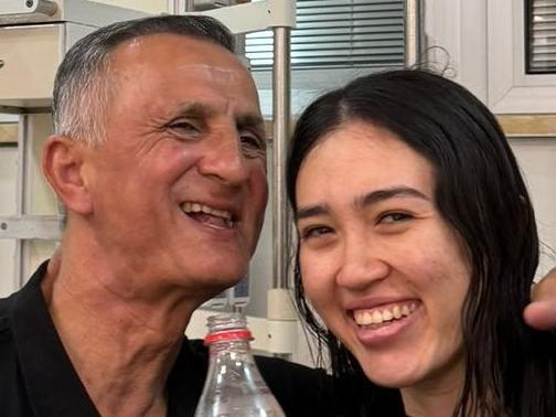 Noa Argamani and her father Yakov Argamani, pose with bottles of Coke after the military said that Israeli forces have rescued four hostages alive from the central Gaza Strip, in Ramat Gan, Israel, in this handout image obtained by Reuters on June 8, 2024. Picture: IDF