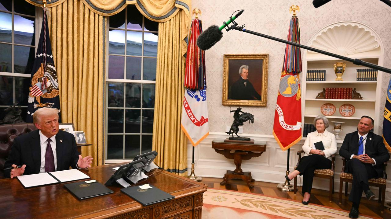 A portrait of Andrew Jackson, as well as the Bronco Buster sculpture, can be seen as Chief of Staff Susie Wiles and Deputy Chief of Staff Dan Scavino look on. A huge neutral coloured rug lies in place after Joe Biden’s blue one was removed. Picture: AFP