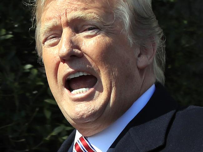 President Donald Trump responds to reporters asking question following a ceremony to honor the 2017 NCAA football national champions, the Alabama Crimson Tide on the White House's South Lawn, in Washington, Tuesday, April 10, 2018. (AP Photo/Manuel Balce Ceneta)