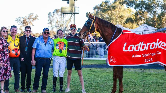 Alice Springs Cup-winning trainer Dick Leech (centre) and jockey Jade Hampson with Write Your Name and connections. Picture: Nikki Westover