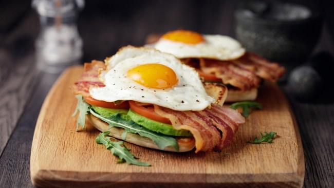 Home made freshness bacon,fried egg with avocado ,tomato and rocket leaves on fried soda bread