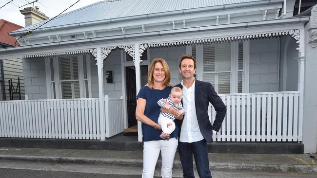 Clair Matthewson, Andrew Cartledge and their baby Archie Cartledge at their Richmond home, which is Melbourne’s best suburb to live in. Picture: Tony Gough