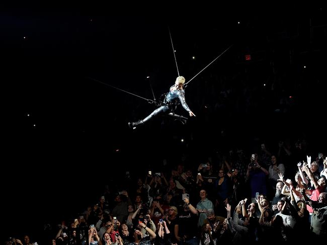 Pink singing and swinging above the crowd for So What. Pic: Kevin Mazur/Getty Images for Live Nation