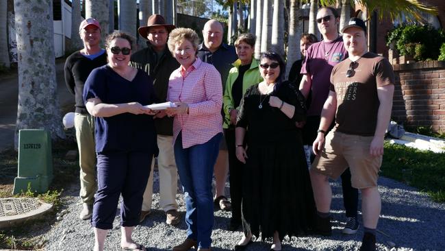 Mount Gravatt East Townhouse Development Action Group giving State Member for Mansfield Corrine McMillan the petition.