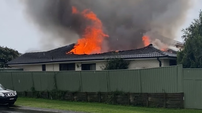 Thick orange flames teared the roof apart. Picture: Nine