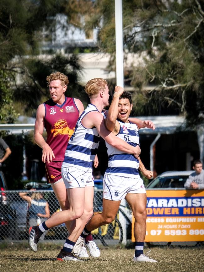 Broadbeach Cats QAFL player Michael Selsby celebrating with Connor Nutting (left). Picture credit: Brooke Sleep Photography.