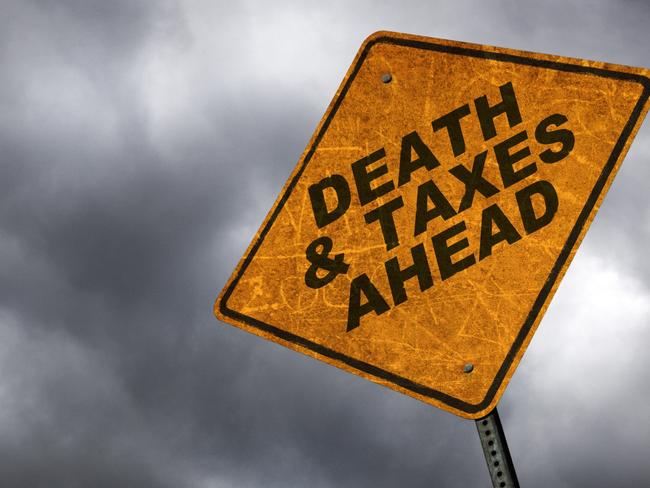 A road sign warning of the inevitability of death & taxes. inheritance tax generic