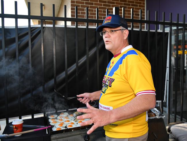 Making breakfast on the barbie for the kids — a well-orchestrated image. Picture: AAP