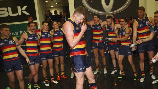 Reilly O’Brien in the changerooms after playing in a win in his AFL debut in 2016. Picture: Sarah Reed