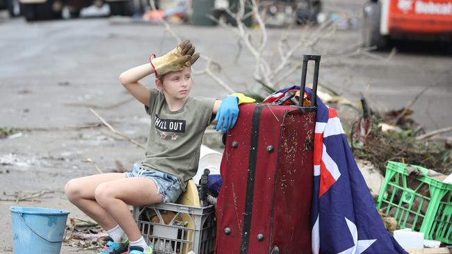 Lucy Bryant, 10, cleaning out her family home in Vincent St, Auchenflower. Picture: Annette Dew