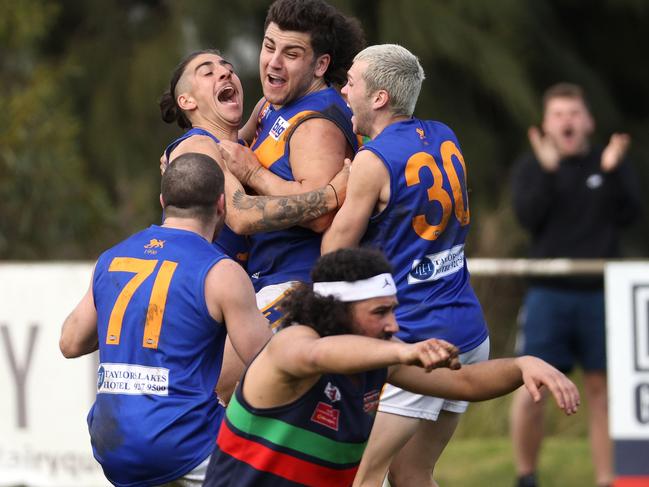 EDFL: Taylors Lakes’ Bowey Larizza celebrates a goal with teammates. Picture: Hamish Blair