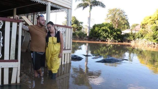 Queen St residents Courtney Azzopardi, Jay Waters and his mother Chris spent two days constructing a levee around their home in Maryborough - to no avail.