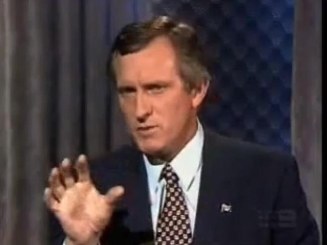 John Hewson attempts to explain the GST effect on a birthday cake on national TV.