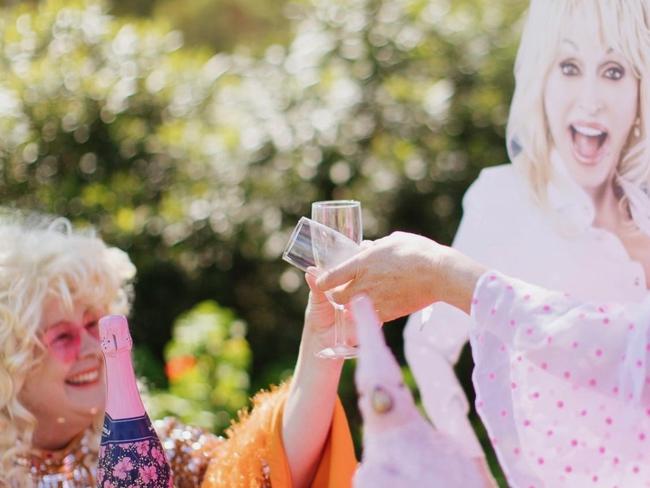 Susie Rae and Dolly Parton have a champagne and getting ready for the festival. Photo: Supplied.