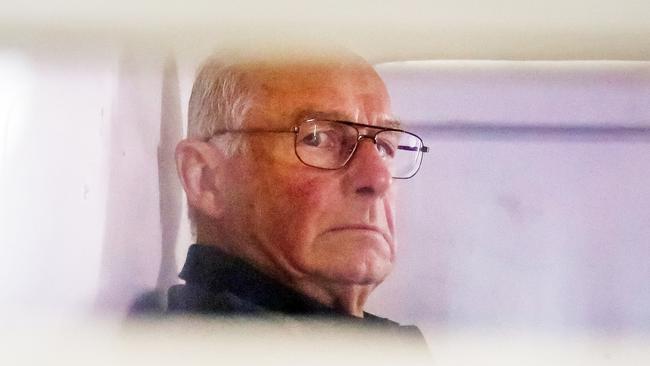 Roger Rogerson stares out from a police vehicle as he is taken to court for the Jamie Gao case. Picture Craig Greenhill