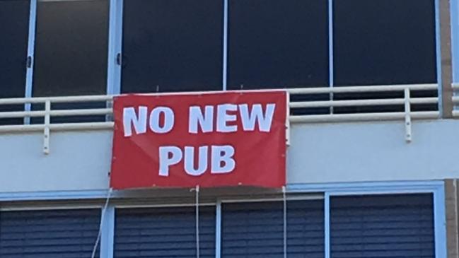 A protest banner hung from a building in Burleigh.