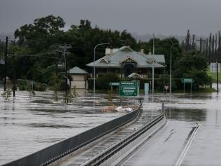 The Windsor Bridge partly submerged under rising floodwaters on Thursday. Picture: Getty