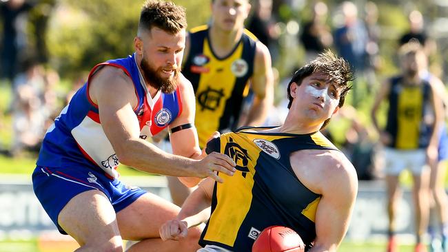 Jesse Tardio tries to stop Mitchell Moschetti. Picture: Josh Chadwick