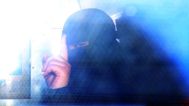 *****EXCLUSIVE DAILY TELEGRAPH - NOT FOR PUBLICATION WITHOUT PERMISSION - SPEAK TO DAILY TELE PIC DESK FOR PERMISSION***** Pictured arriving at Fairfield Police Station is an 18 year old woman who has been arrested as part of an anti terrorism investigation. Picture: Richard Dobson