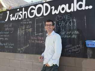 THE WRITTEN WORD: Senior pastor Scott Muir from Central Church Ipswich beside the blackboard. Picture: Sarah Harvey