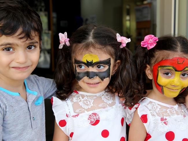 Iraqi triplets Maryian, Joseph and Fabronia (4) share in the Nowruz celebrations.