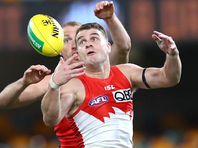 BRISBANE, AUSTRALIA - AUGUST 01: Nick Hind of the Saints competes with Tom Papley of the Swans during the round nine AFL match between St Kilda Saints and the Sydney Swans at The Gabba on August 01, 2020 in Brisbane, Australia. (Photo by Jono Searle/AFL Photos/via Getty Images)