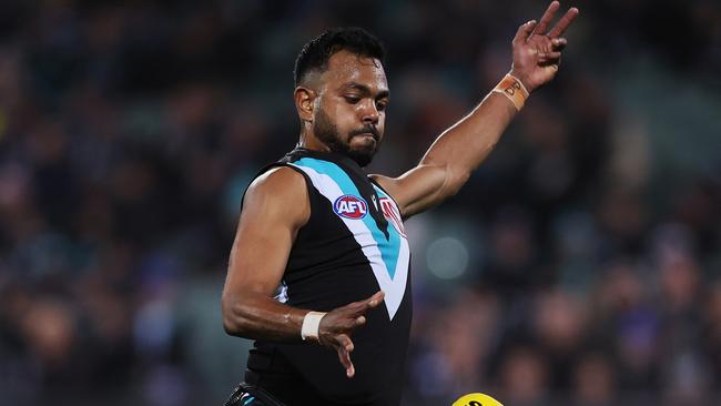 ADELAIDE, AUSTRALIA - JULY 08: Junior Rioli of the Power kicks a goal during the 2023 AFL Round 17 match between the Port Adelaide Power and the Gold Coast Suns at Adelaide Oval on July 8, 2023 in Adelaide, Australia. (Photo by James Elsby/AFL Photos via Getty Images)