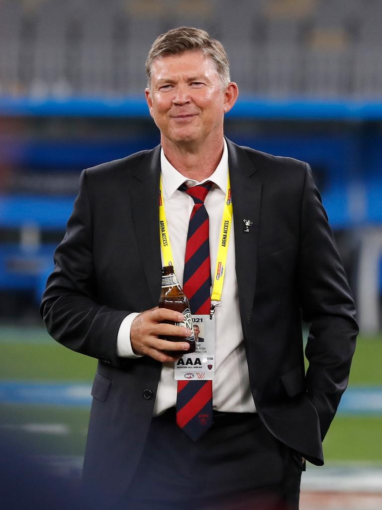 Gary Pert enjoys a cold one after the Demons’ premiership win. Picture: AFL Photos/Getty Images