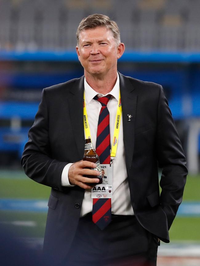 Gary Pert enjoys a cold one after the Demons’ premiership win. Picture: AFL Photos/Getty Images