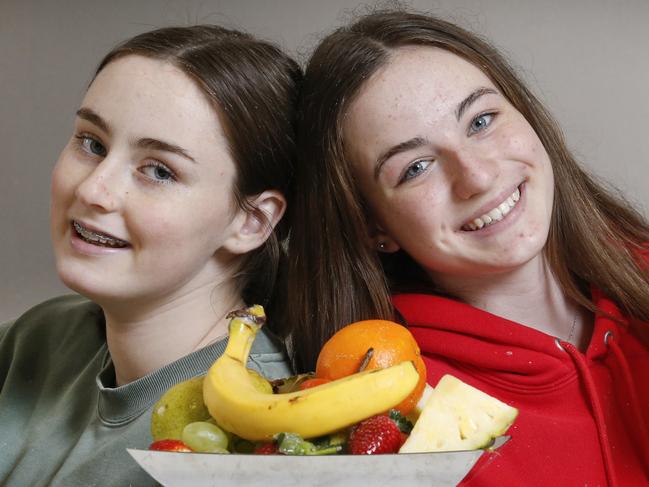 Bucking the fast food trend, healthy teens Francesca 14 and friend Issy 15 love a good smooth and making a mess in the kitchen.    Picture: David Caird