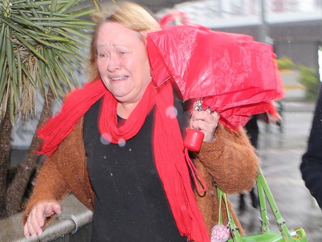 Brisbane Magistrates Court A woman believed to be the mother of Morgan Isles-English leaves court in a distressed state after his brief appearence on Greivous Bodily Harm charged from a one punch incident involving his father Photographer Philip Norrish NO BY LINE