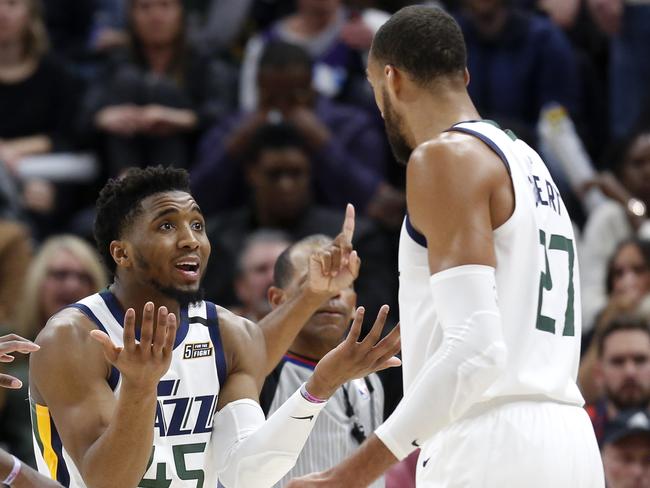 Utah Jazz's Bojan Bogdanovic (44), Royce O'Neale (23), Donovan Mitchell (45) and Rudy Gobert (27) talk during a timeout as the Jazz trail the Houston Rockets in the second half of an NBA basketball game Saturday, Feb. 22, 2020, in Salt Lake City. The Rockets won 120-110. (AP Photo/Kim Raff)