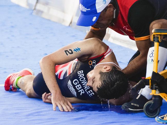 Jonathan Brownlee collapses after the finish line.