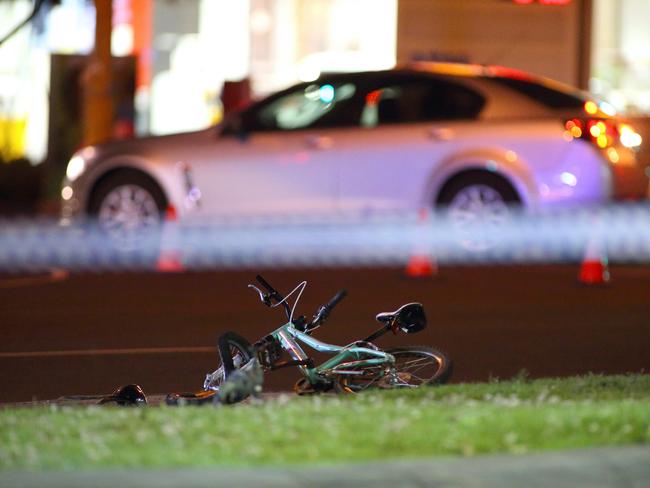 Police tape across the scene as the teen girl’s bike lays wrecked. Picture: Patrick Herve