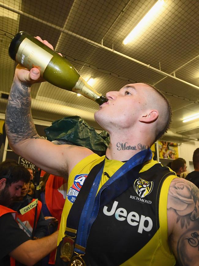 Enjoying some champagne after winning the Grand Final. Picture: Quinn Rooney/Getty Images