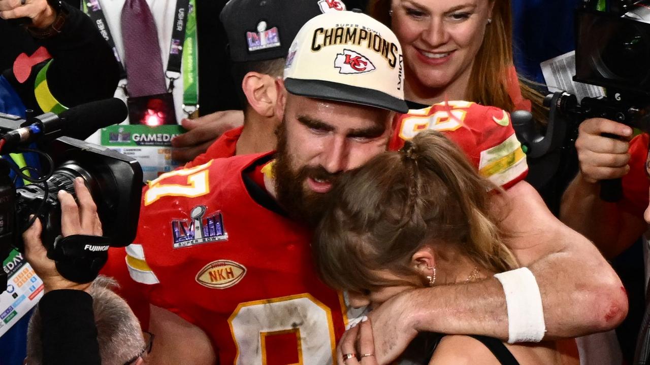 (FILES) US singer-songwriter Taylor Swift and Kansas City Chiefs' tight end #87 Travis Kelce embrace after the Chiefs won Super Bowl LVIII against the San Francisco 49ers at Allegiant Stadium in Las Vegas, Nevada, February 11, 2024. Coachella day two was heavy on alt rock throwbacks including a much-anticipated No Doubt reunion, but it was Taylor Swift -- who wasn't on the lineup and didn't perform -- creating buzz. Her mere presence at the mammoth music festival set the internet alight, after she made a much-speculated on appearance...as a fan, canoodling and dancing with beau Travis Kelce as Bleachers performed a rollicking set. Bleachers is fronted by Jack Antonoff, Swift's friend and longtime producer. (Photo by Patrick T. Fallon / AFP)
