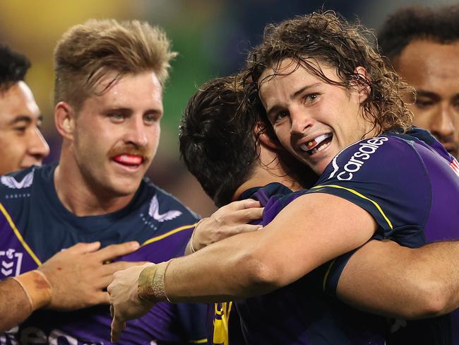 MELBOURNE, AUSTRALIA - APRIL 30:  Brandon Smith of the Storm celebrates with Nicho Hynes of the Storm after scoring a try during the round eight NRL match between the Melbourne Storm and the Cronulla Sharks at AAMI Park on April 30, 2021, in Melbourne, Australia. (Photo by Robert Cianflone/Getty Images)