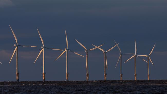 Wind turbines generate electricity at Burno Bank Off Shore Wind Farm in Liverpool, England.