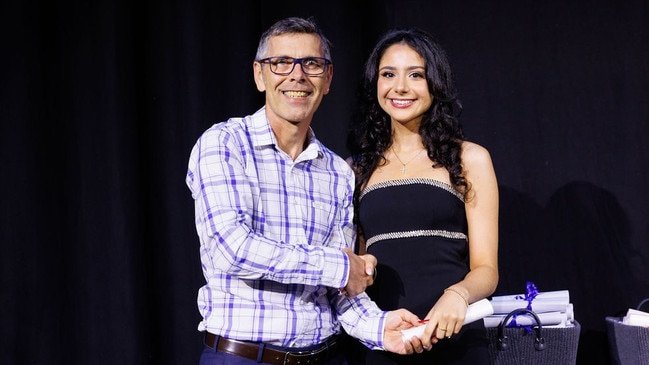 Paraskevi receiving her graduation certificate from Stuart Dwyer. Picture: Supplied