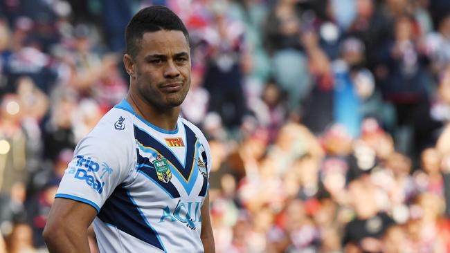 Jarryd Hayne of the Titans gestures after accidentally kicking the ball into touch which then allowed the Roosters to get possession, score and win the game during the NRL Round 26 rugby league match between the Sydney Roosters and Gold Coast Titans at the Allianz Stadium in Sydney, Saturday, September 2, 2017. (AAP Image/David Moir) NO ARCHIVING, EDITORIAL USE ONLY