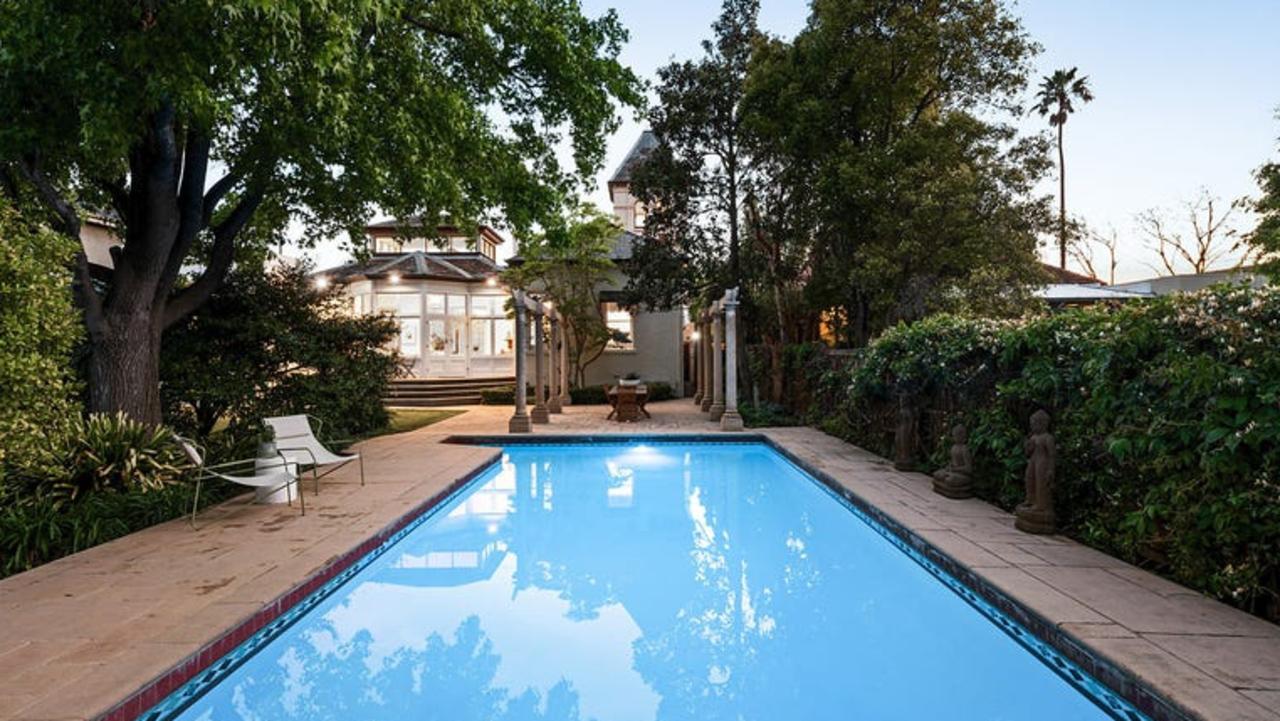 The home features in-ground pool and outdoor entertaining area at the rear.