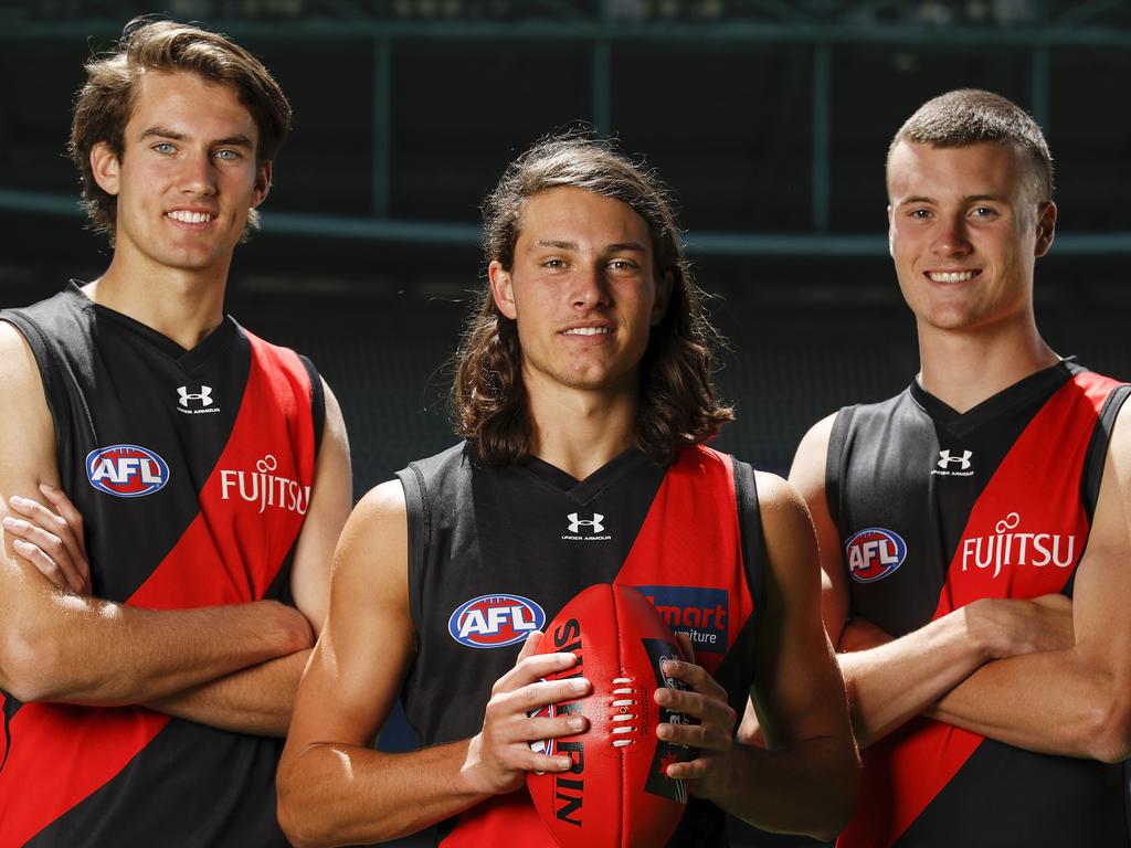 MELBOURNE, AUSTRALIA – DECEMBER 10: Zach Reid, draft selection #10 for the Bombers (L), Archie Perkins, draft selection #9 for the Bombers and Nik Cox, draft selection #8 for the Bombers (R) pose for a photo during the NAB AFL Draft media opportunity at Marvel Stadium on December 10, 2020 in Melbourne, Australia. (Photo by Dylan Burns/AFL Photos via Getty Images)