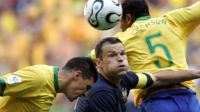 Socceroos striker Mark Viduka (centre) contests a header with Brazil’s Lucio (left) and Emerson at the 2006 World Cup.