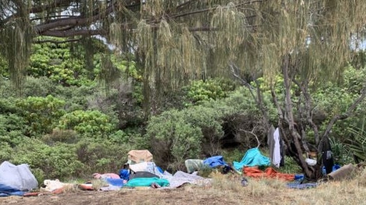 A homeless camp by the popular Gold Coast beach and the North Burleigh headland.