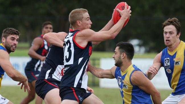 Bernie Vince wins the hard ball. Picture: David Crosling