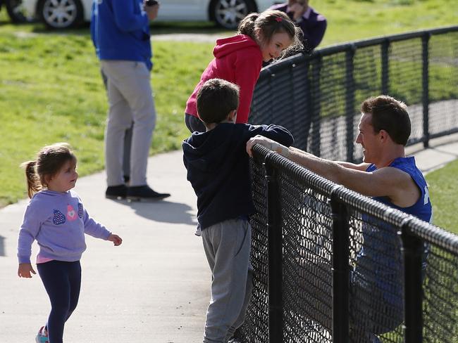 Drew Petrie talks to son Jack and two other two children at training. Picture: Wayne Ludbey