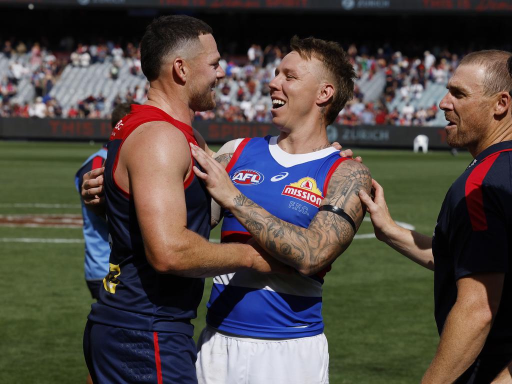 James Harmes with former teammate Steven May and old coach Simon Goodwin after Bulldog’s clash with Melbourne on Sunday. Harmes and May had several fiery clashes on the field. Picture: Michael Klein